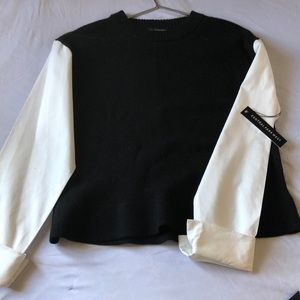 Black sweater with white sleeves